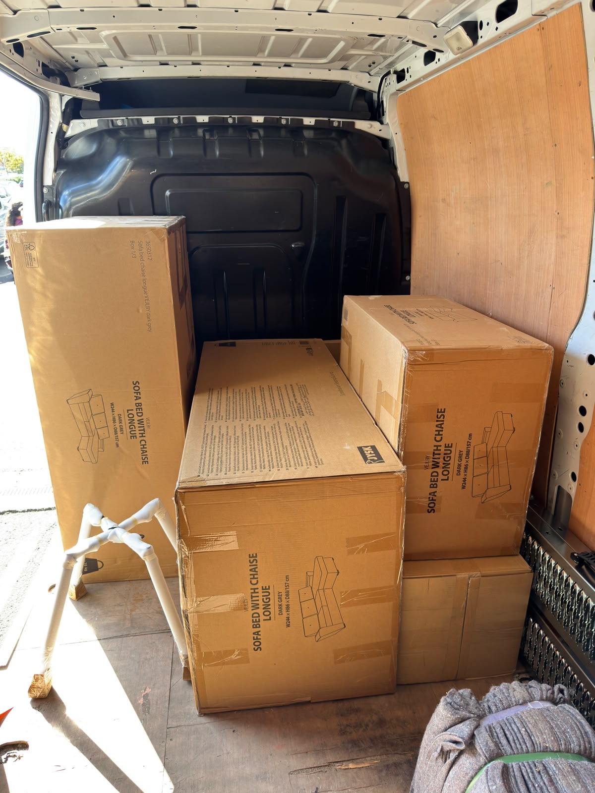 Boxed furniture loaded inside a moving van